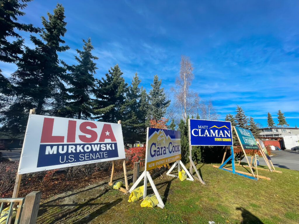 OCT 11, 2022-ANCHORAGE, AK, US: Group of campaign signs for Lisa Murkowski, Jennie Armstrong, Walker Drygas, Matt Claman, Les Gara, Jessica Cook for Alaska midterms elections. Sidewalk view