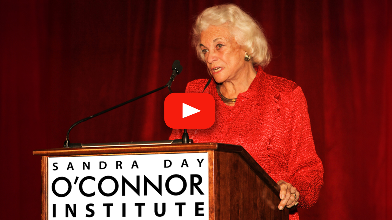 Sandra Day O'Connor at a podium with YouTube play button