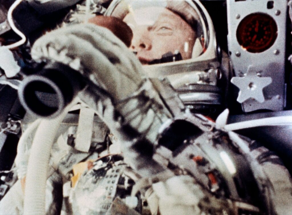 John Glenn inside the cramped cockpit of the Friendship 7 spacecraft.