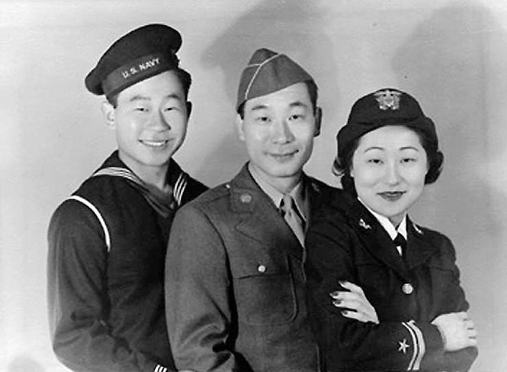 Susan Ahn Cuddy (right) poses in uniform with her brothers, Ralph (left) and Philip, center, who also served during the war in the Navy and Army, respectively.