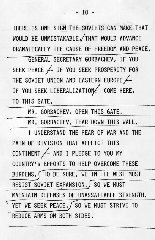 Typed manuscript page from President Reagan's 1987 Berlin speech showing the passage containing the phrase "Mr. Gorbachev, tear down this wall." Editorial markings, underlines, and handwritten revisions appear throughout the text.