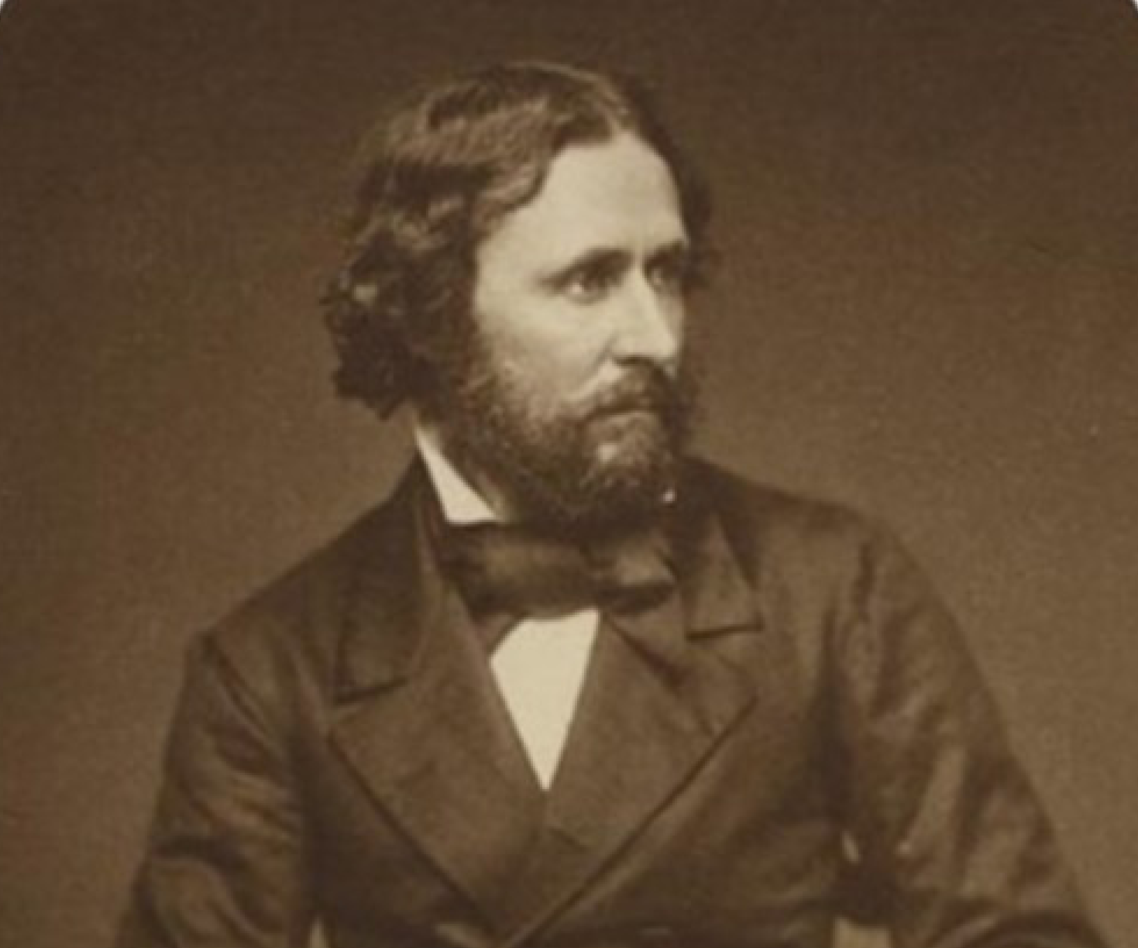 Black-and-white historic photograph of John C. Frémont, a bearded man wearing a dark suit coat and bow tie.