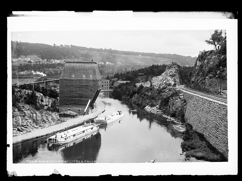 Canal boats traveling through Little Falls, New York, carrying passengers and freight along the Erie Canal.