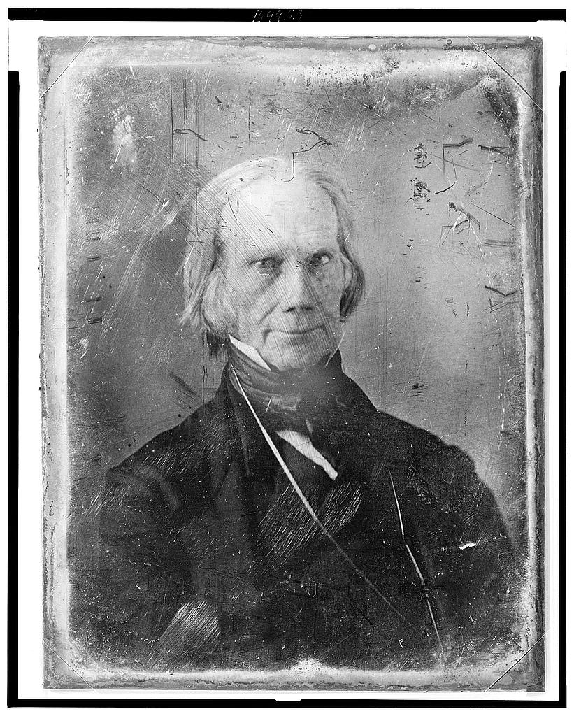A black-and-white daguerreotype portrait of Henry Clay, a lean, white-haired man in formal 19th-century dress, looking directly at the viewer with a composed, serious expression.