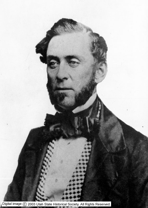 A black-and-white photographic portrait of Samuel Brannan, a heavyset man in 19th-century formal dress, with dark hair and a direct gaze.
