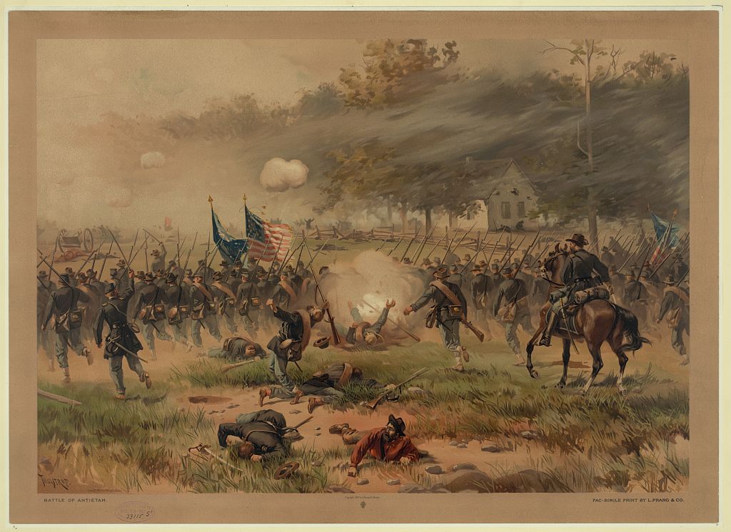 A late-19th-century chromolithograph depicting Union and Confederate lines clashing at the Battle of Antietam, with mounted officers and infantry in combat.