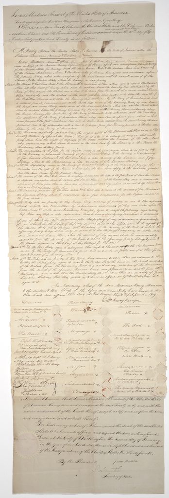 A tall, handwritten manuscript document on aged paper. At top, a proclamation by President James Madison introduces the treaty text; below are the treaty’s articles, the signature of William Henry Harrison, and columns of names and marks of Delaware, Potawatomi, and Miami signers, with wax seals. Madison’s ratification statement, dated January 2, 1810, and signature appear at the bottom.

